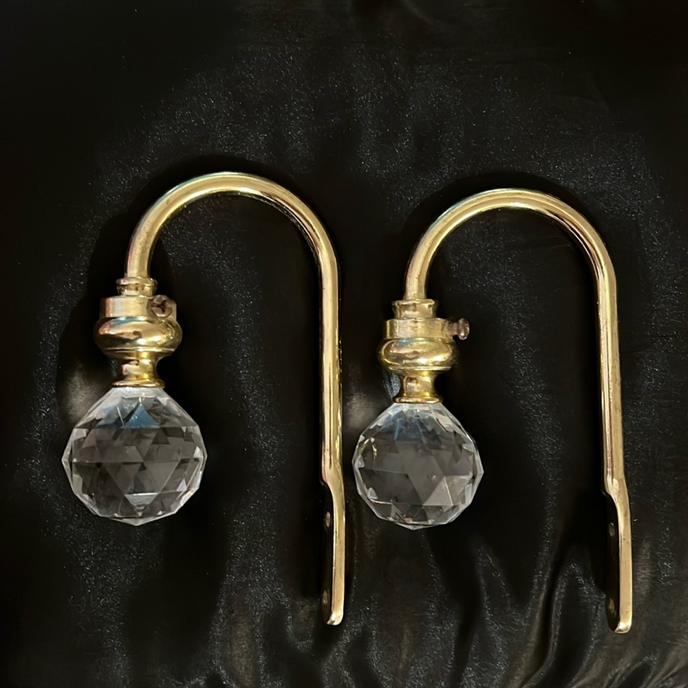 Lucite, metal and plastic “crystal ball” curtain tie backs